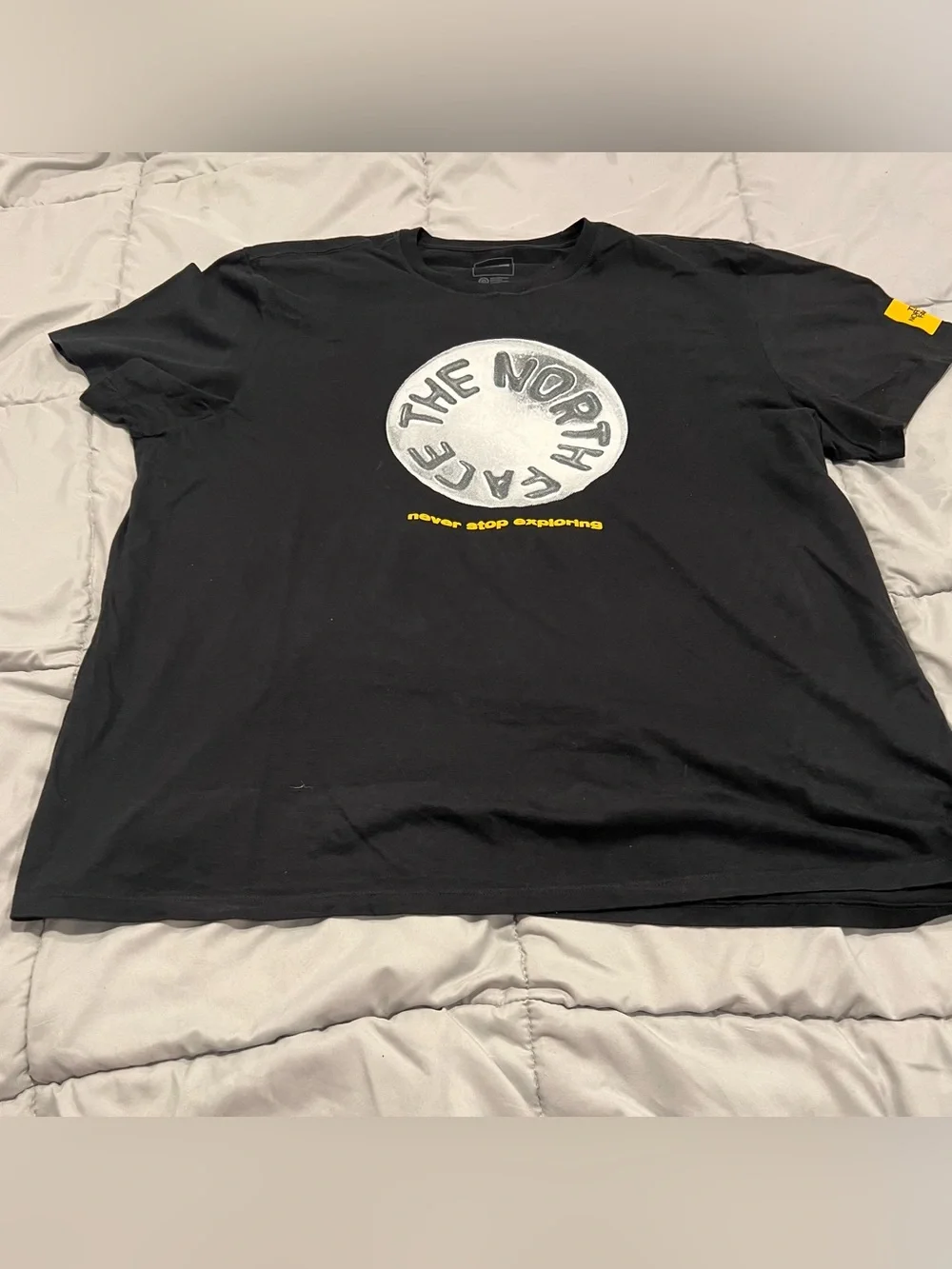 The North Face Men's Black Tee with White Circle Logo and Yellow Text XXL